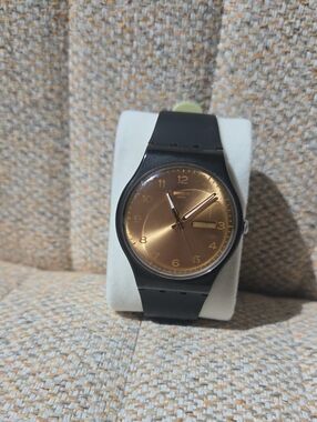 Swatch Black Strap Bronze Dial Analog Watch with Day-Date